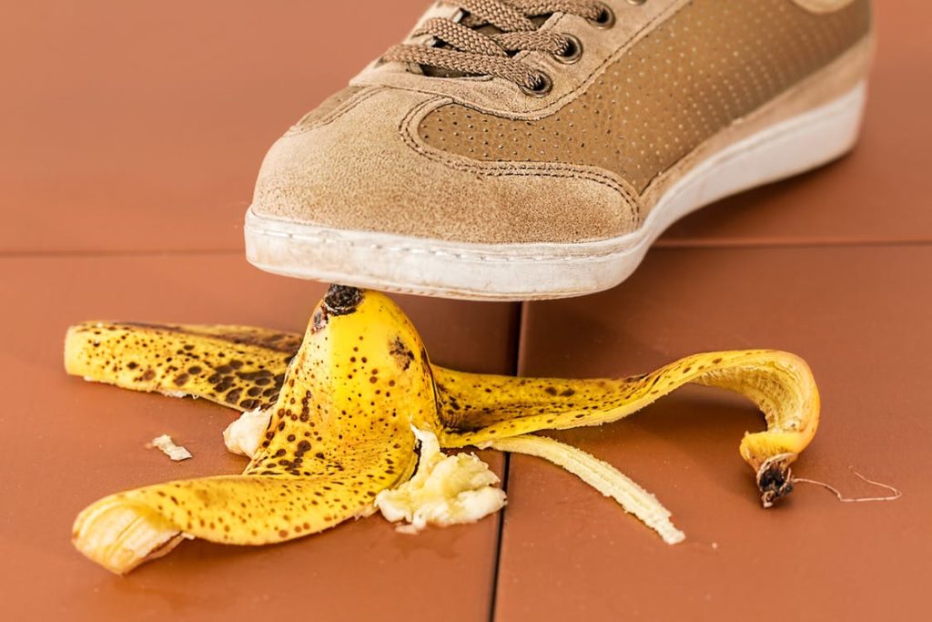 Person about to step on a banana skin