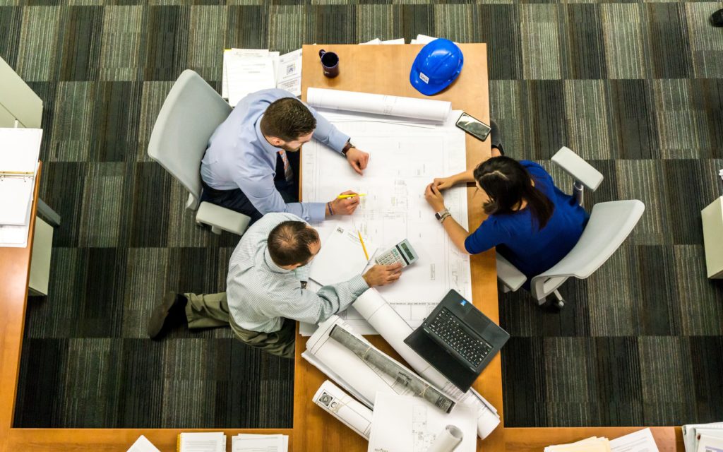 People working around a desk