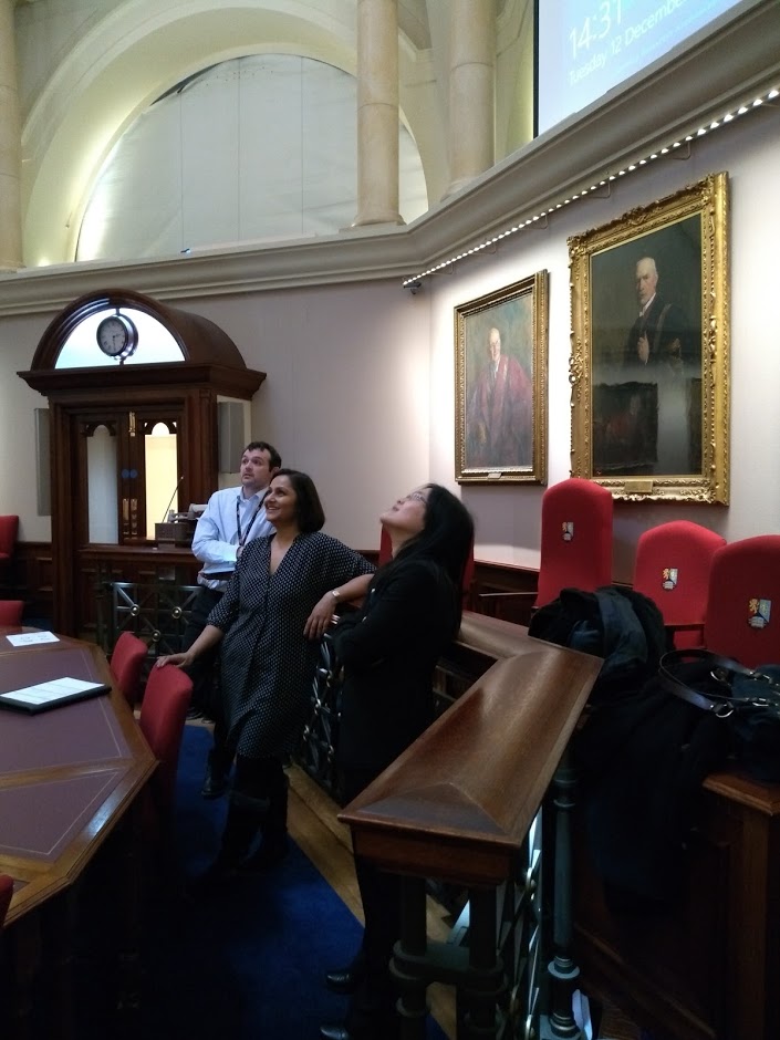 People smiling in the senate chamber