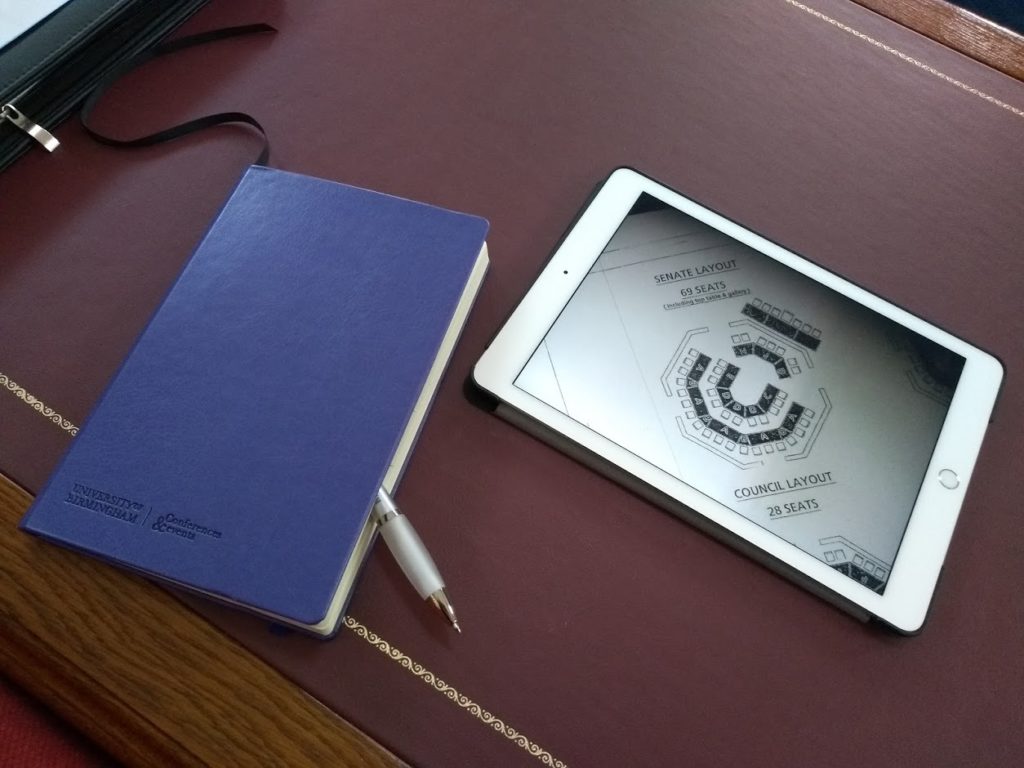 Note book and ipad on a desk