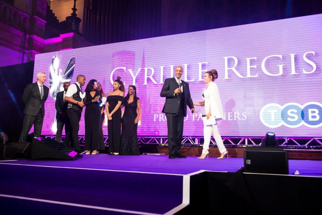 People on stage accepting awards