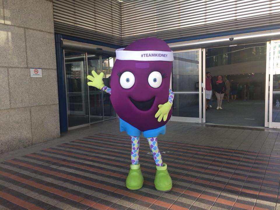 Kidney mascott waving