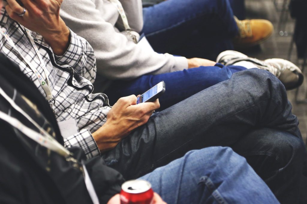 Commuter looking at their smartphone