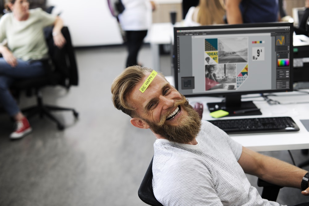 Man smiling in office