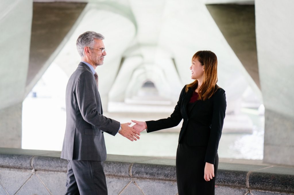 Man and woman shaking hands