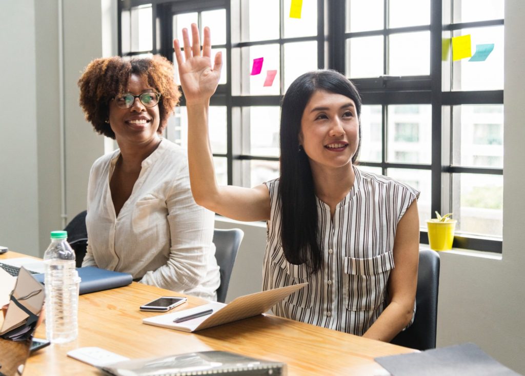 woman raising her hand