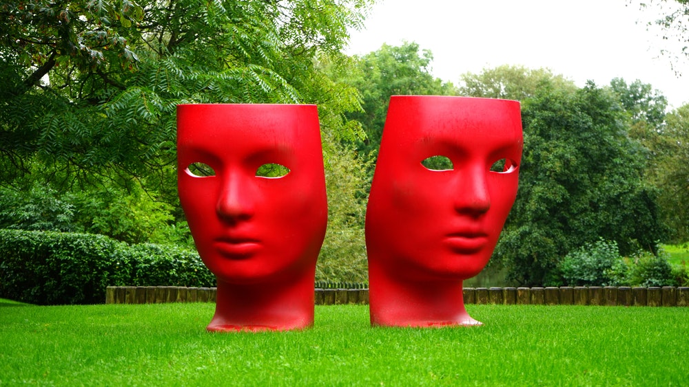 Sculptures of masks in a park