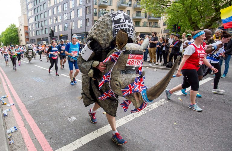 Man dressed as a rhino running a marathon