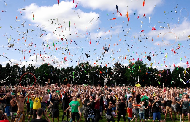 event outdoors throwing up juggling batons