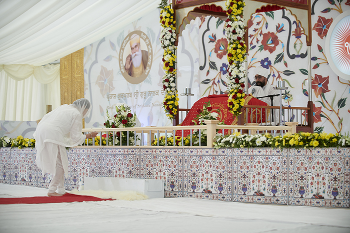 Woman bowing in front of prayer book