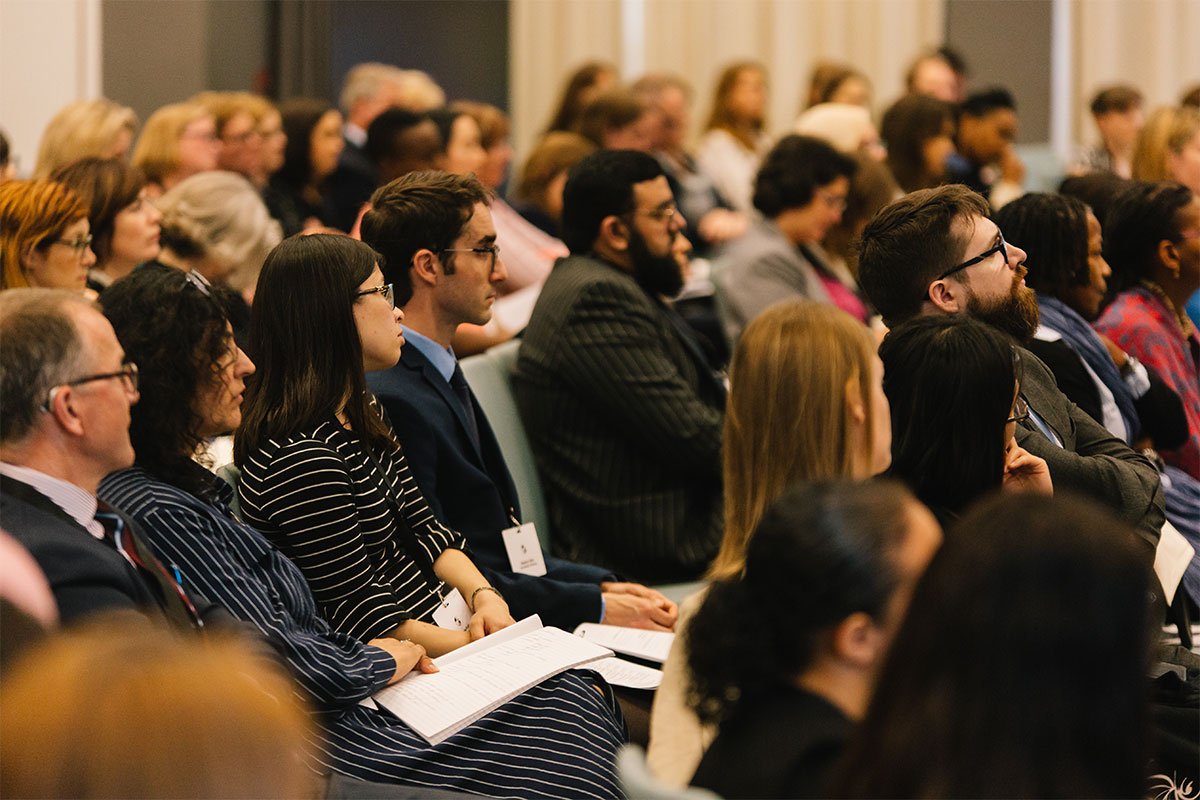 Group of people listening to a presentation