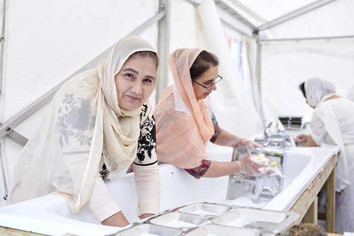 Women cleaning trays