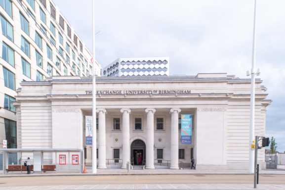 Exterior of The Exchange with posters hanging on the front.