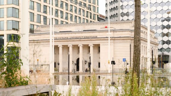 Exterior shot of The Exchange building with its four central pillars.