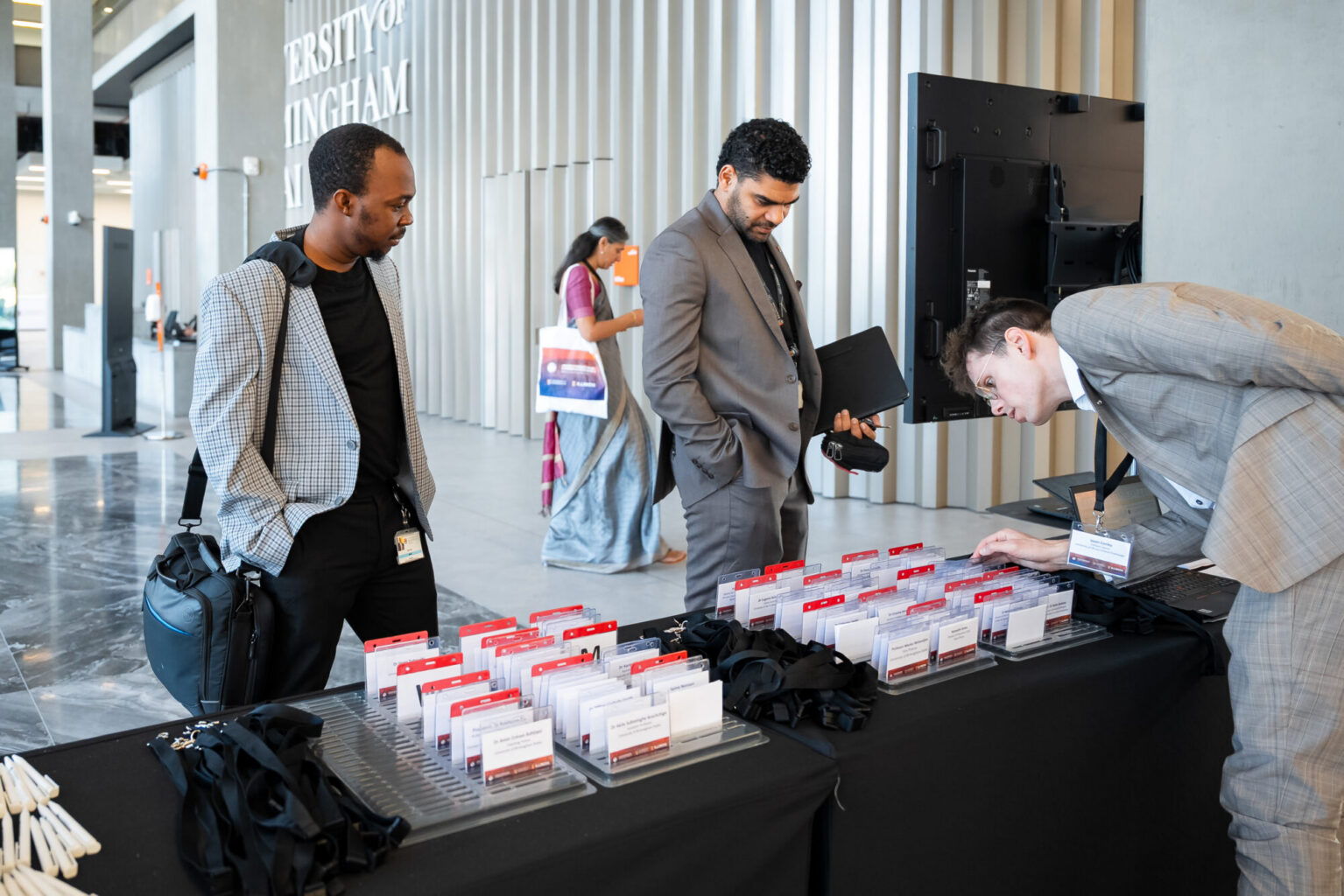 Delegates collecting their name badge
