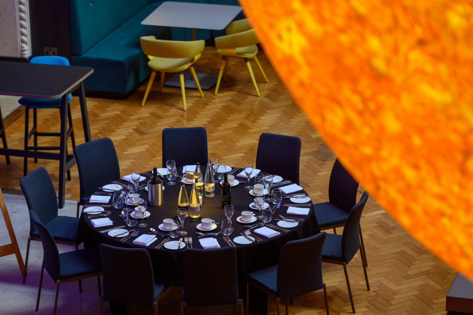 A table laid out for an event with Helios in the foreground